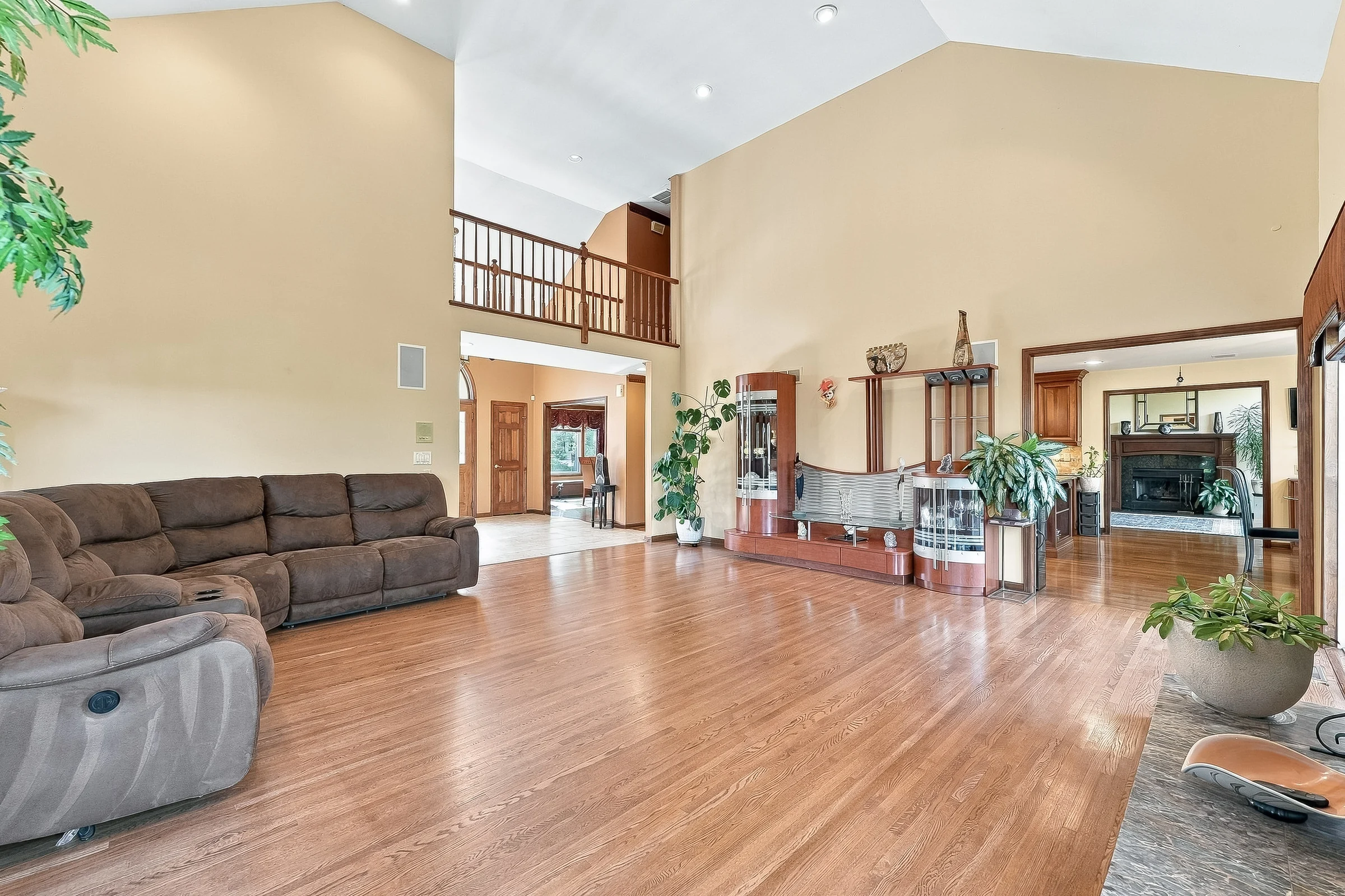 Two-story living room with generous windows and open sightlines