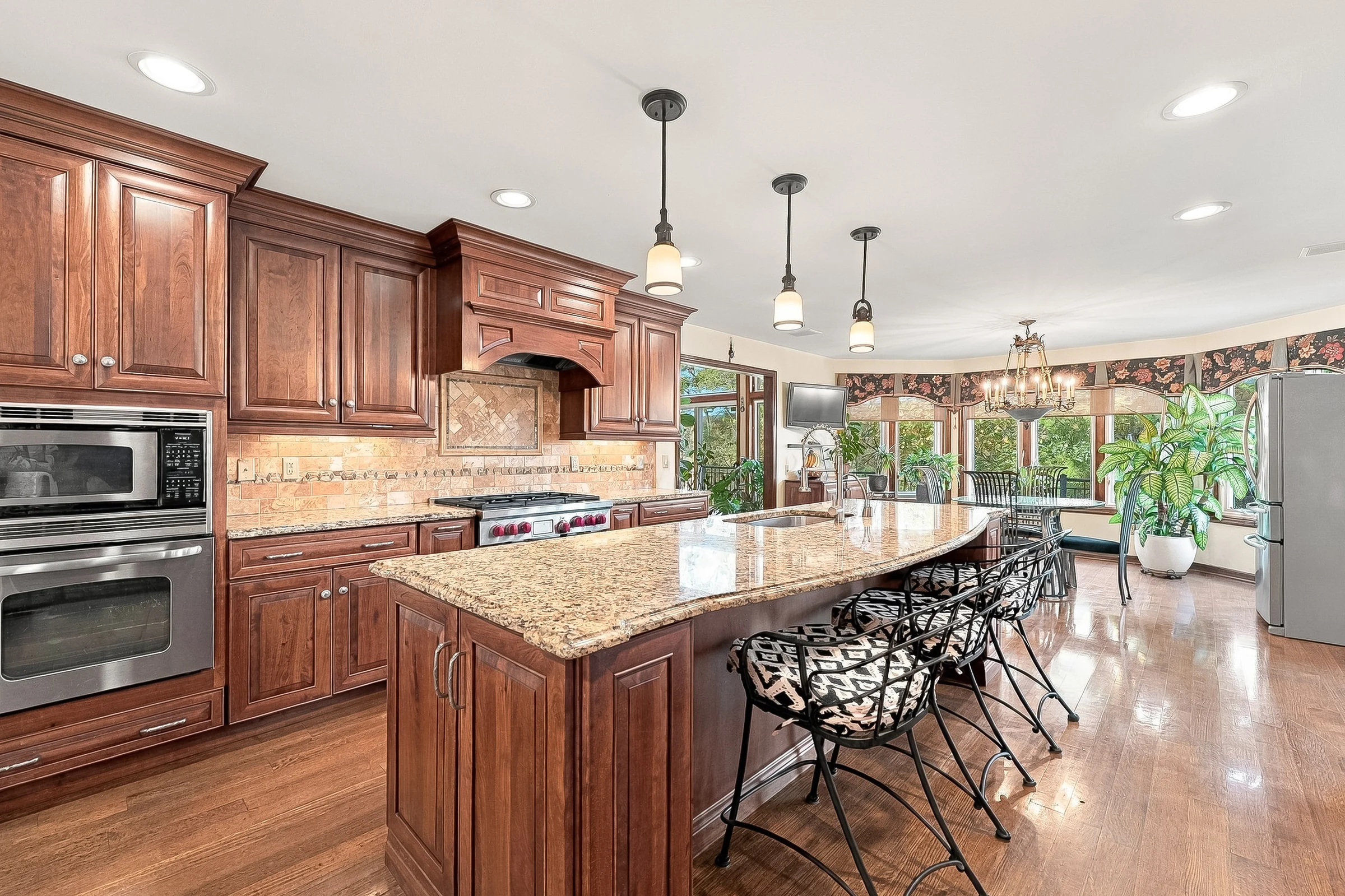 Spacious kitchen with a broad island and adjoining dining area