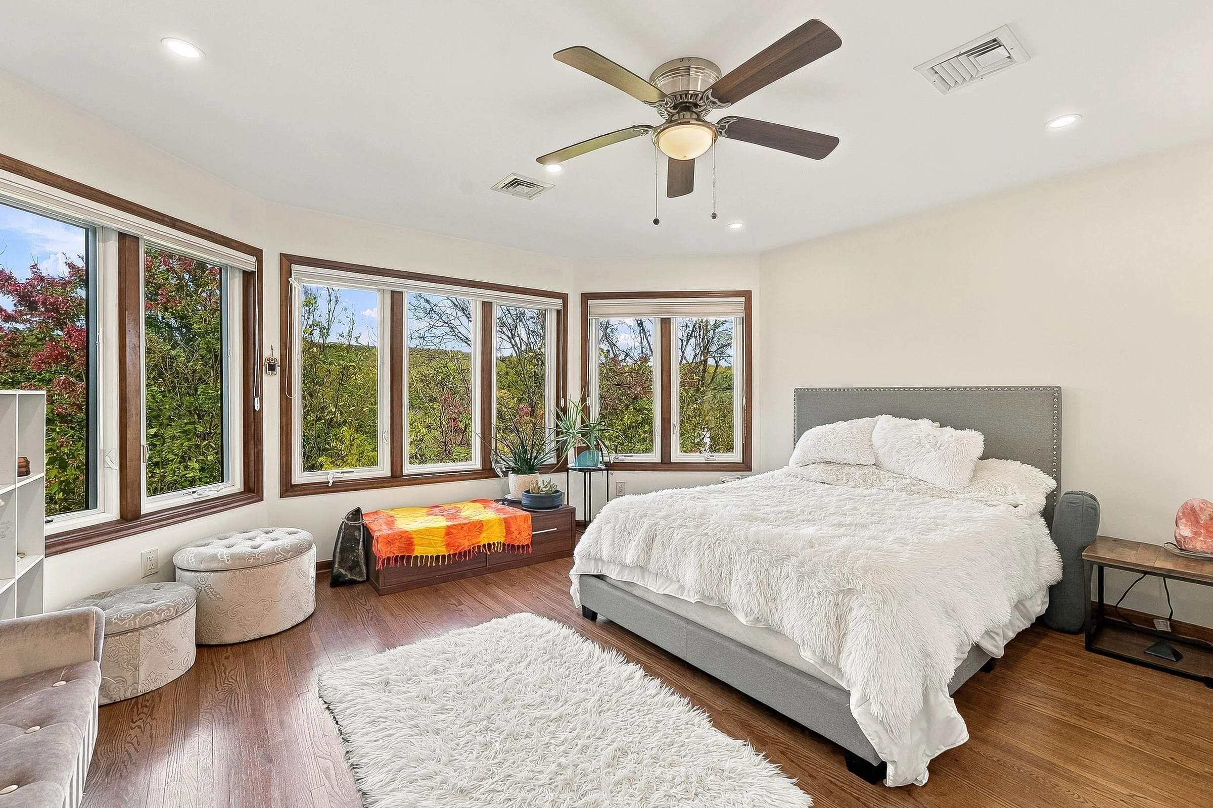 Spacious primary bedroom with generous windows and natural light